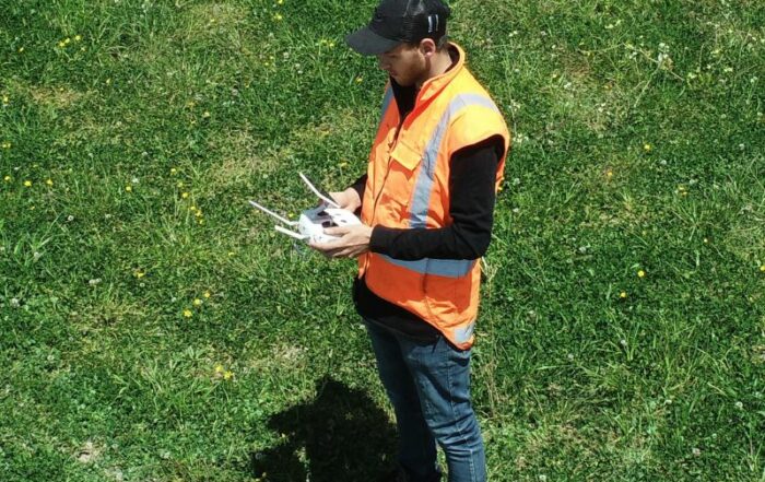 Lewis operating a drone on site